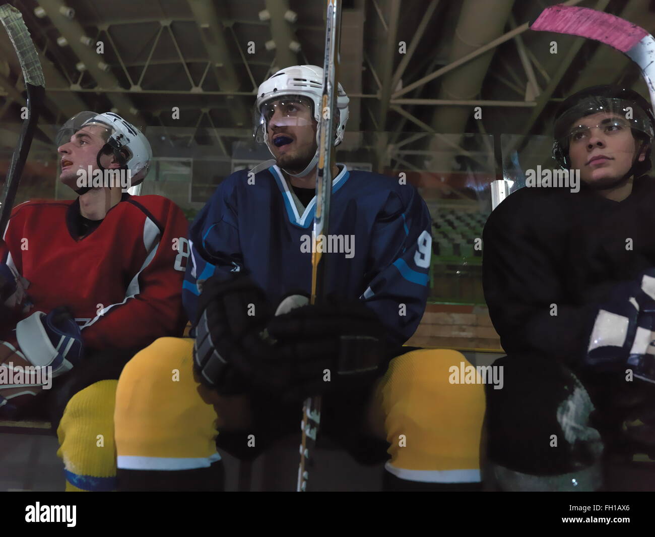 hockey players on bench Stock Photo Alamy