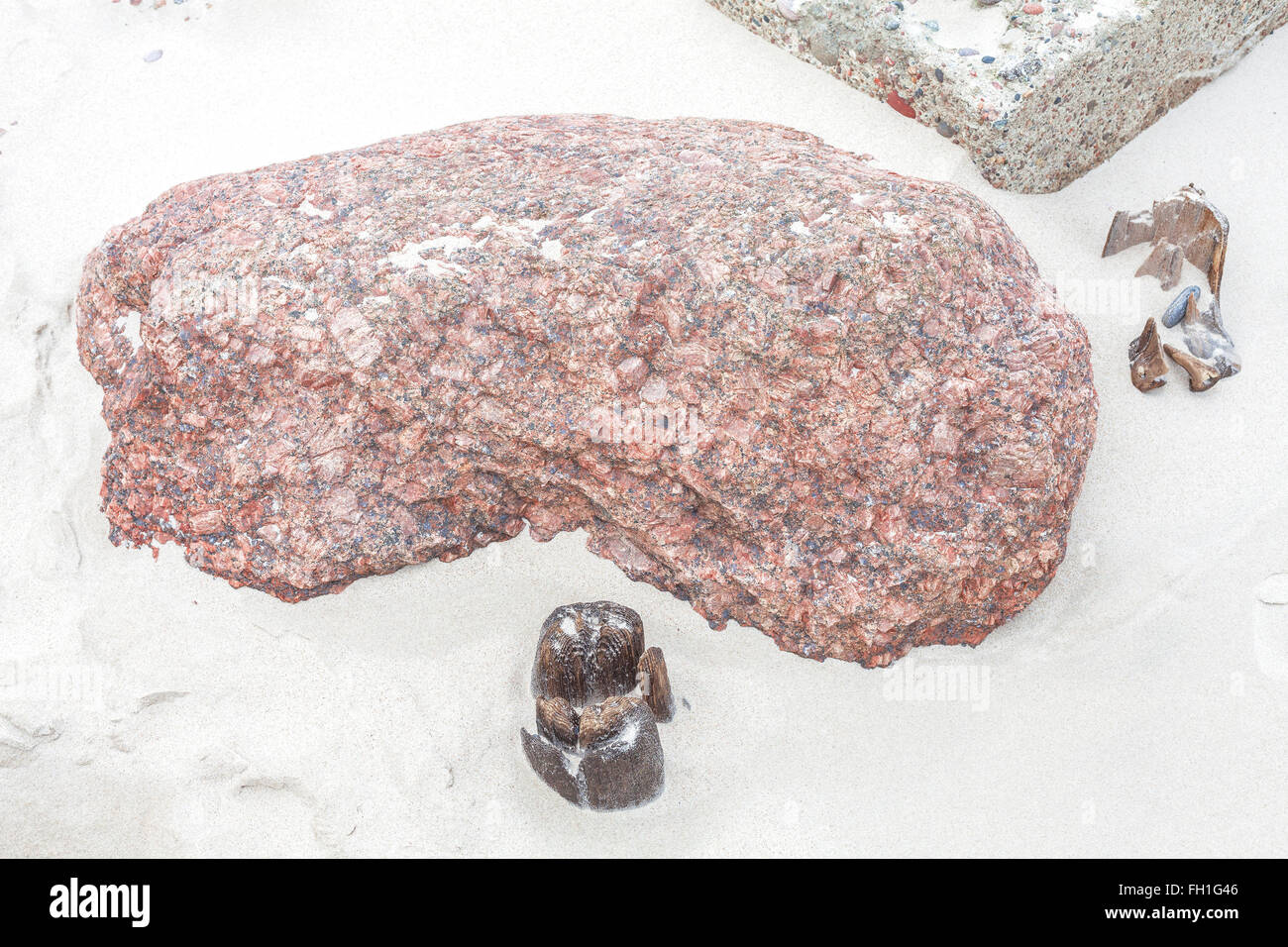 Wood and rock on sand, abstract nature background. Stock Photo