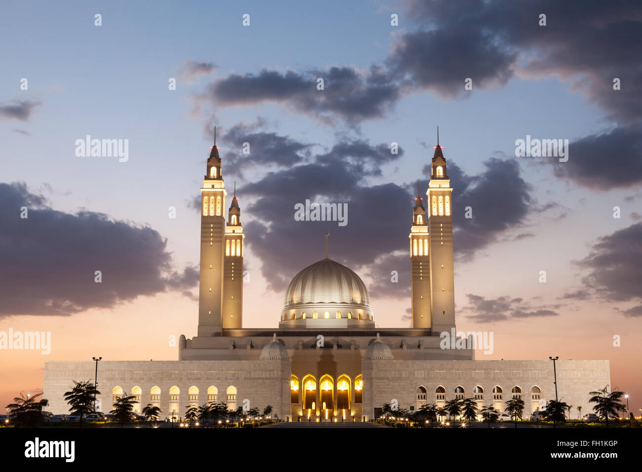 Grand mosque in Nizwa illuminated at night. Sultanate of Oman, Middle East Stock Photo