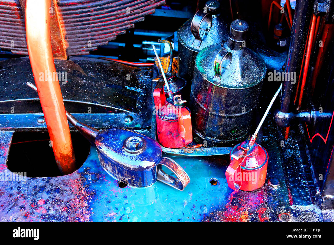 Oil cans and grease heavy machinery Tyneside Stock Photo - Alamy