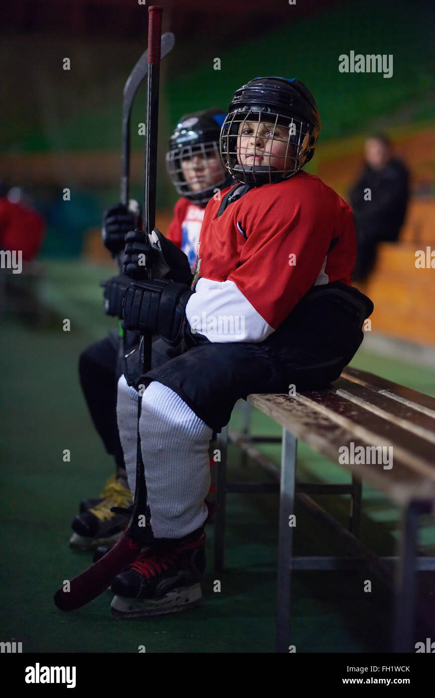 children ice hockey players on bench Stock Photo Alamy