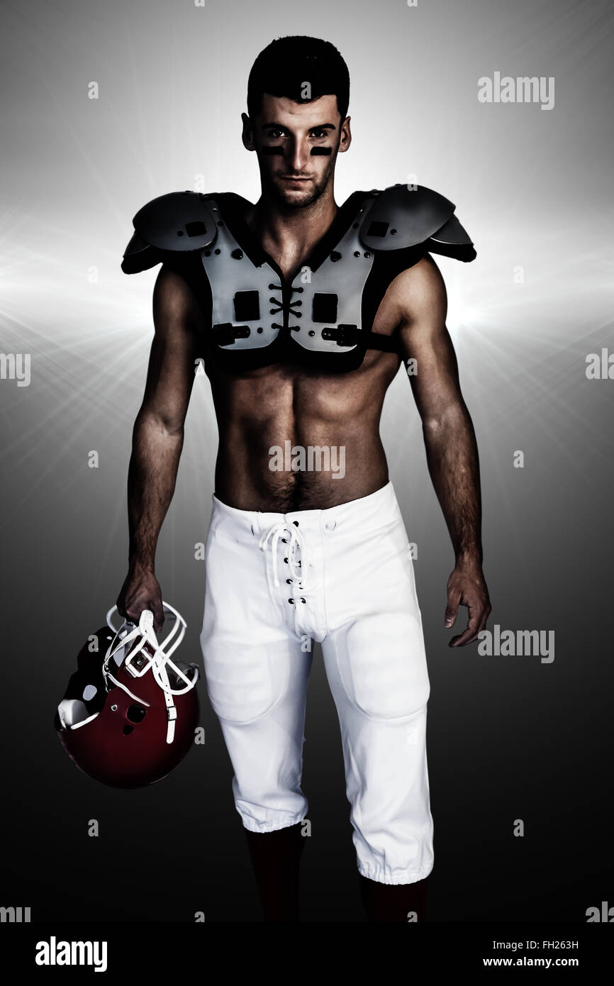 Composite image of portrait of rugby player wearing shoulder pads and