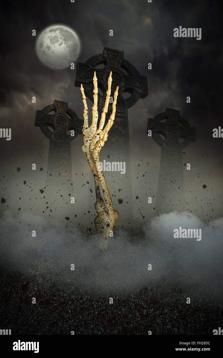 Skeleton hand bursting from the grave Stock Photo - Alamy