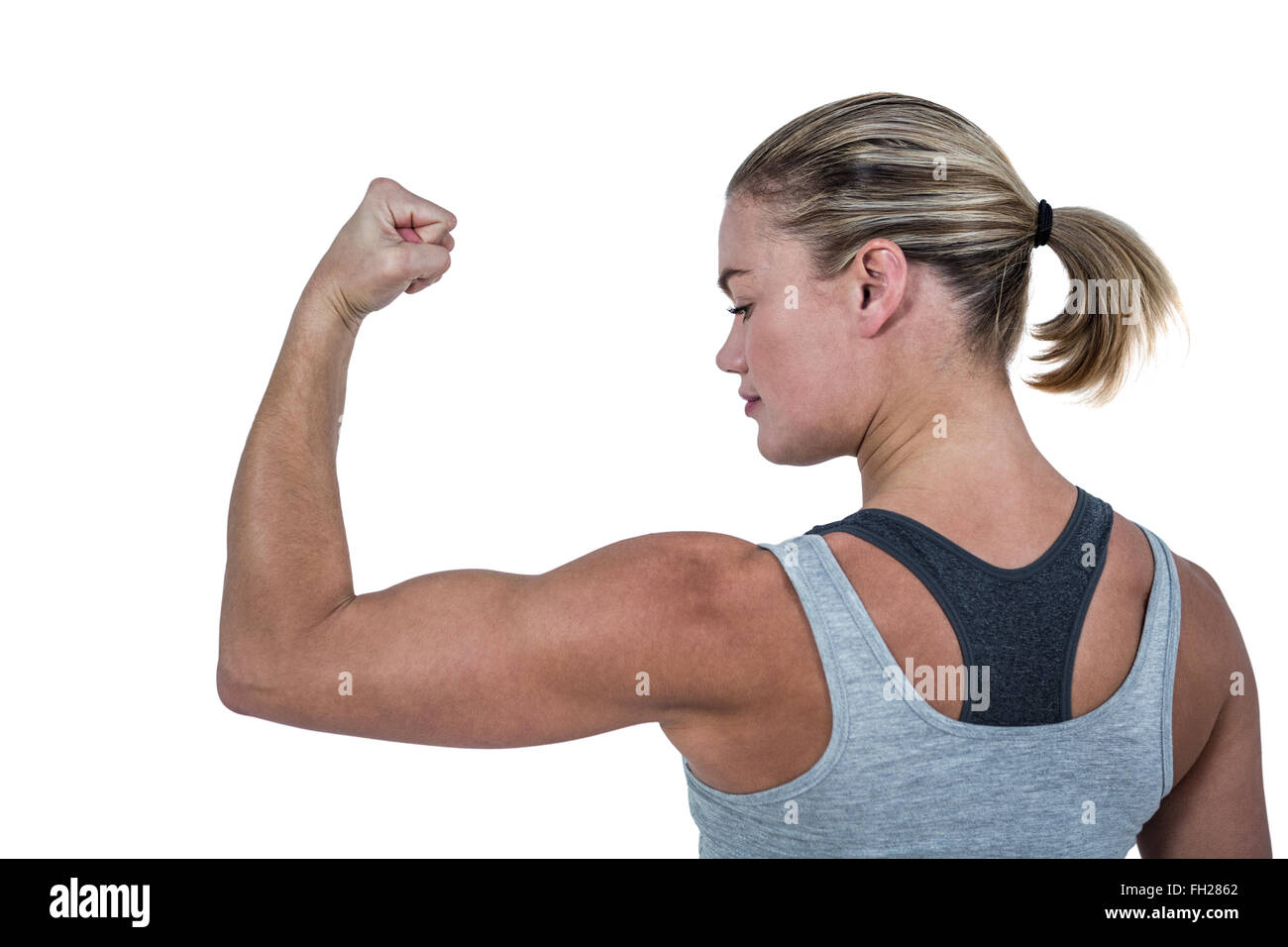 Rear view of muscular woman flexing muscles Stock Photo - Alamy