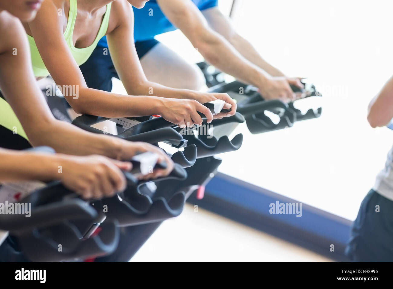 Fit people in a spin class Stock Photo - Alamy