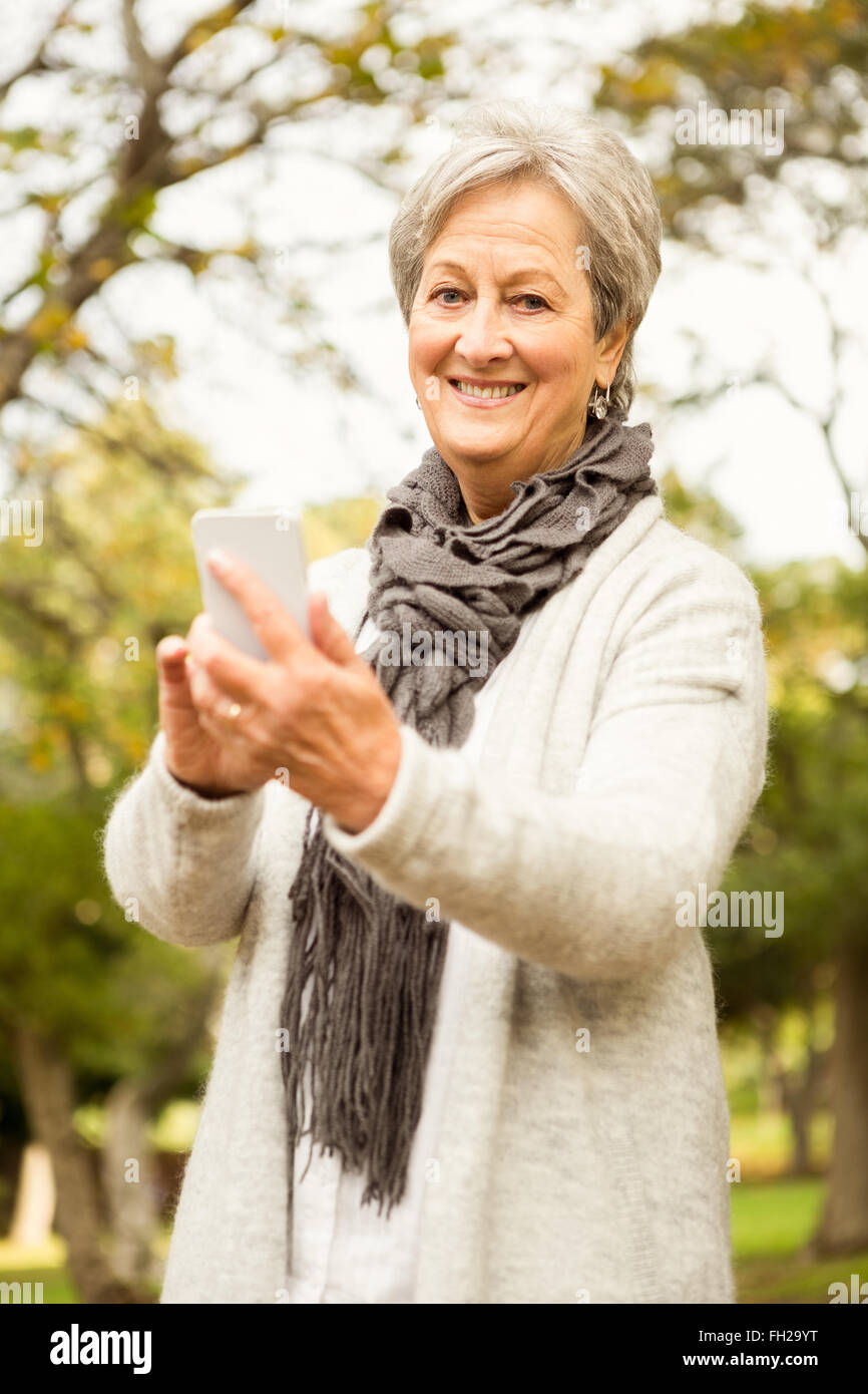 Senior woman in the park Stock Photo - Alamy