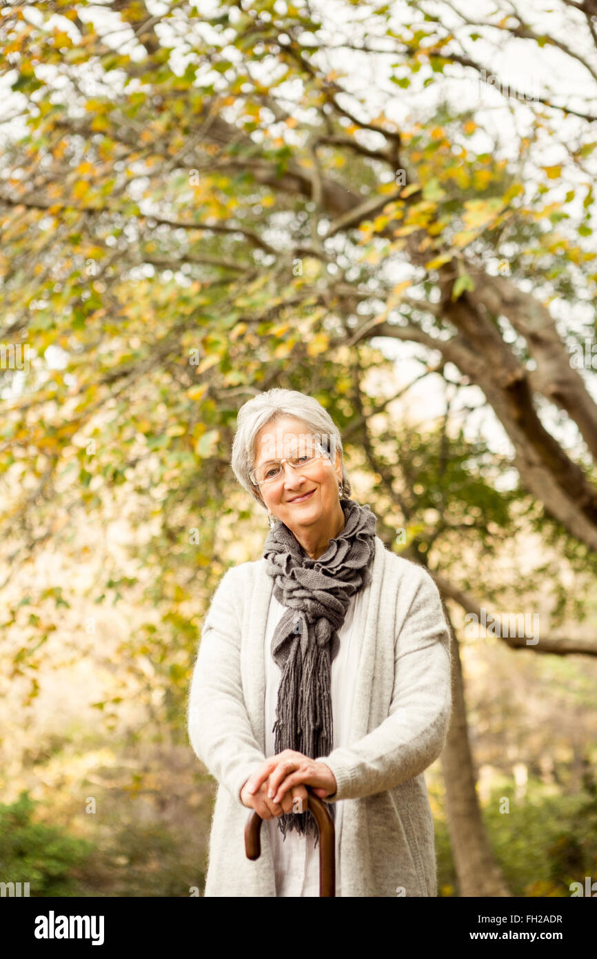Senior woman in the park Stock Photo - Alamy