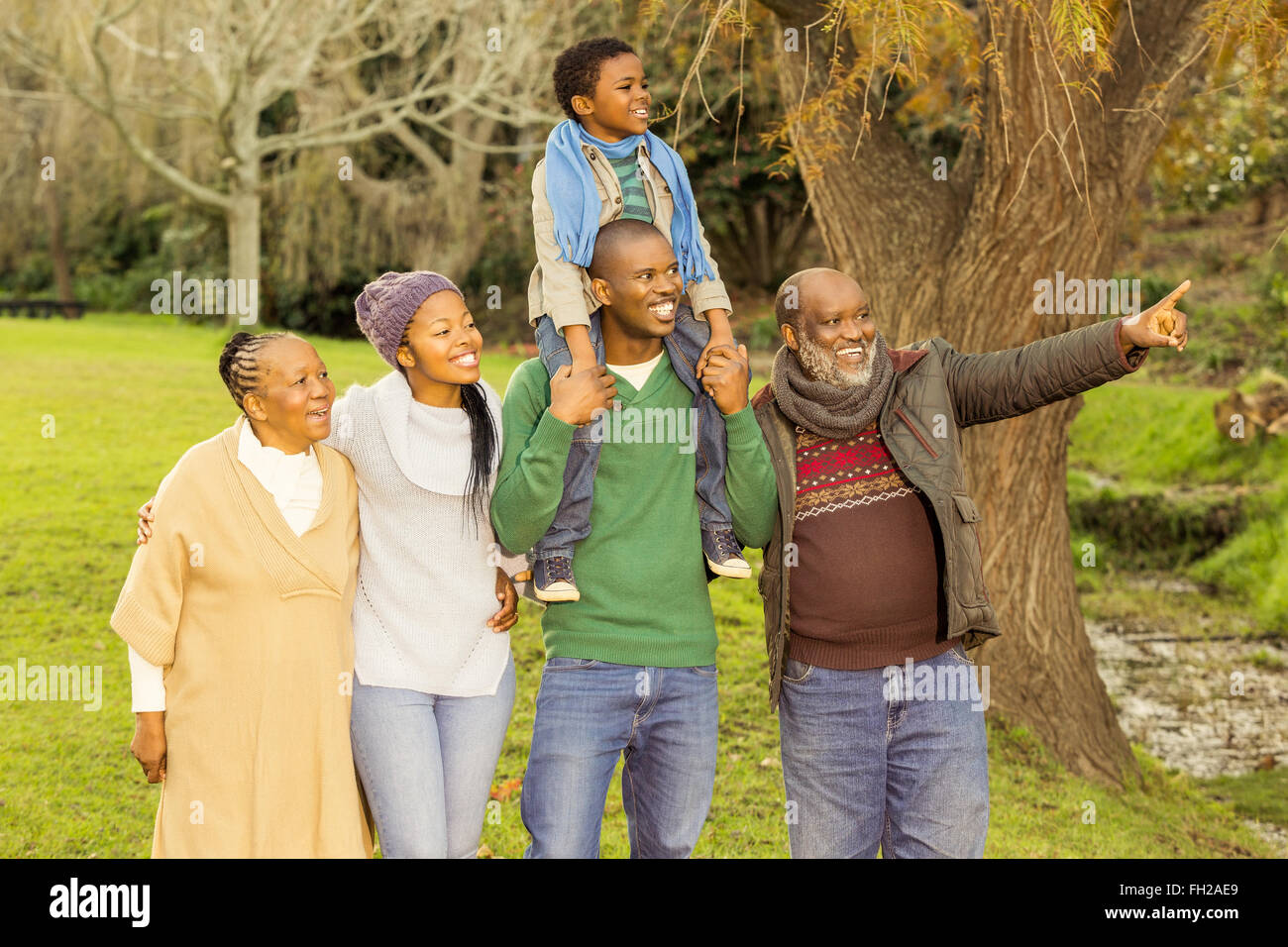 Extended family posing with warm clothes Stock Photo - Alamy