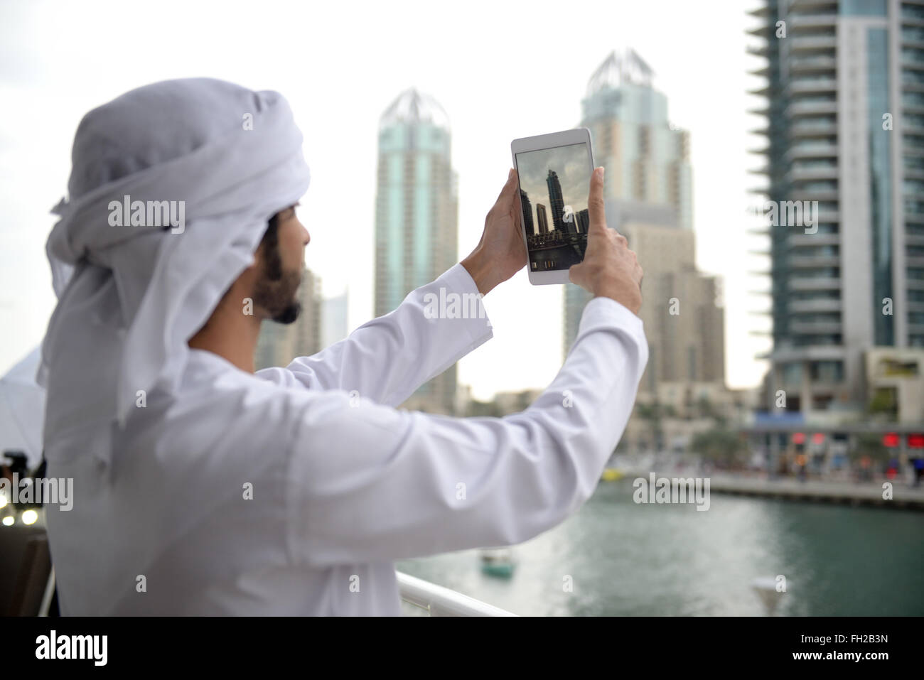 Young arab man holding hi-res stock photography and images - Alamy