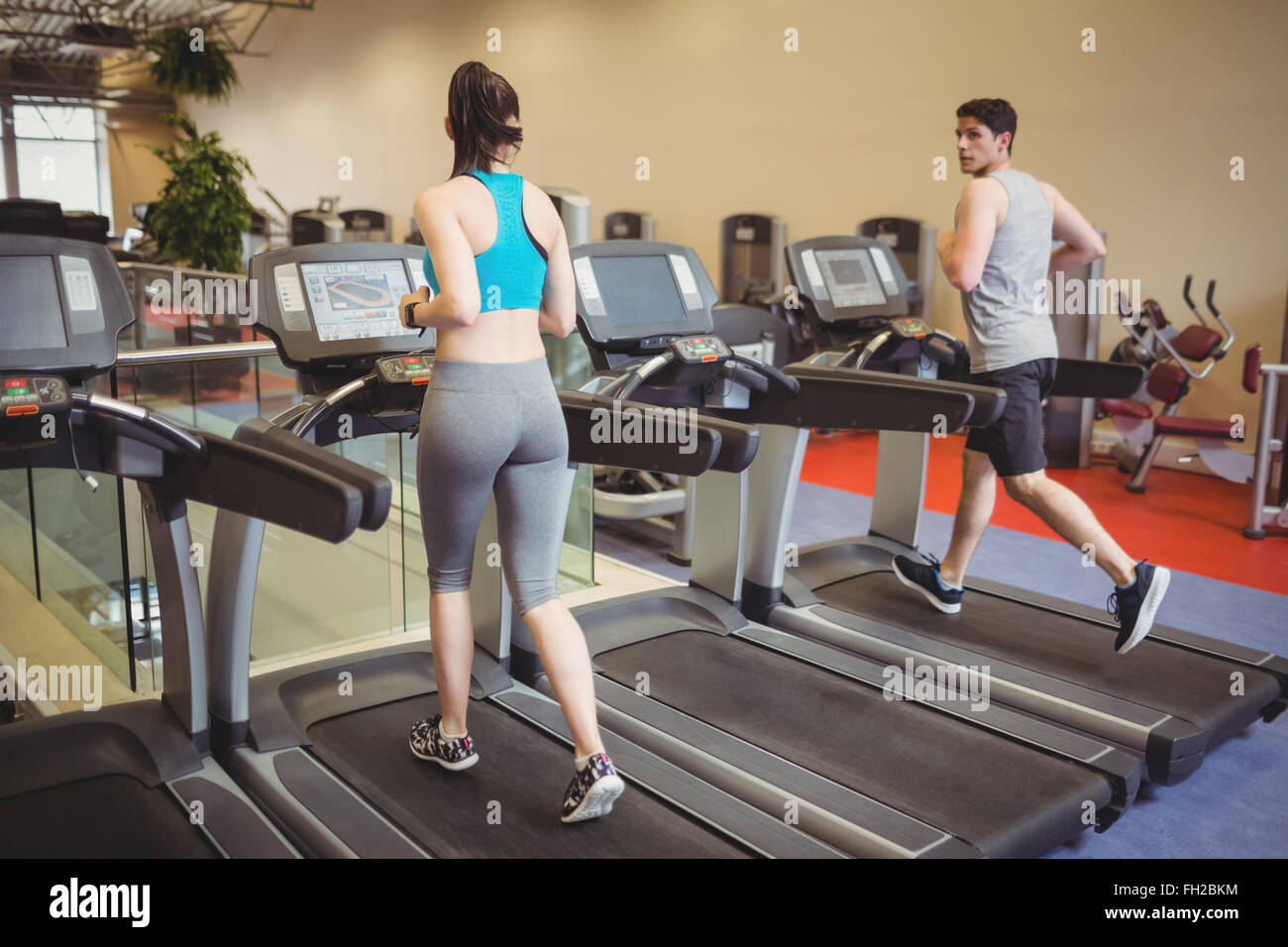 Fit people using the treadmill Stock Photo - Alamy