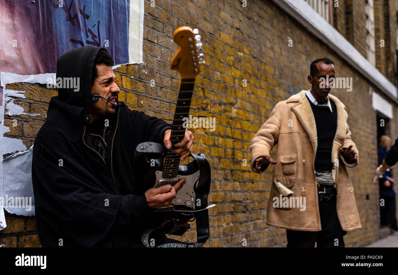 Man playing guitar on Brick Lane, London. Stock Photo