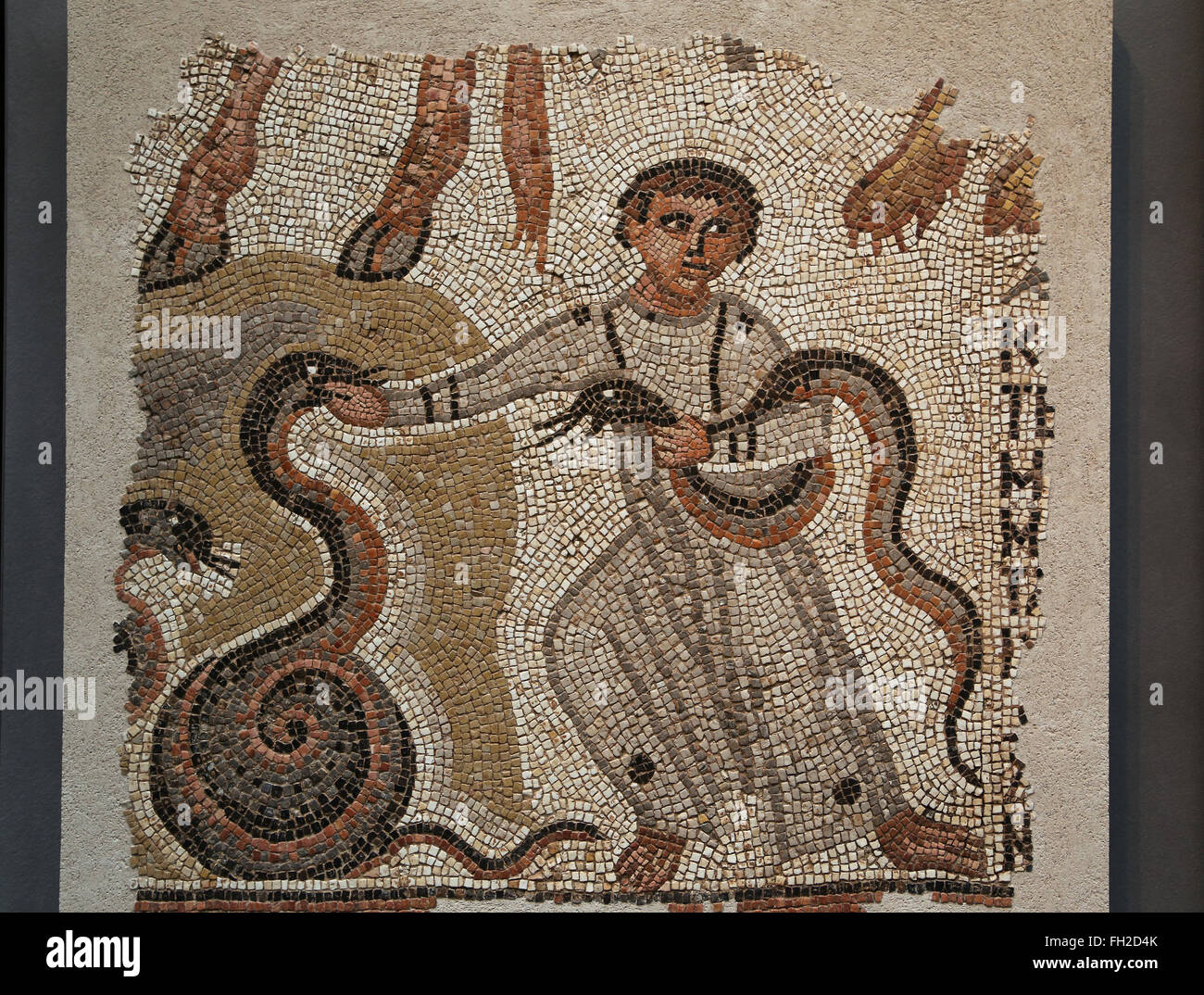 Roman mosaic. Young boy playing with snakes. Early Christian. Syria or Lebanon, 5th century AD. Book of Isai. Stock Photo