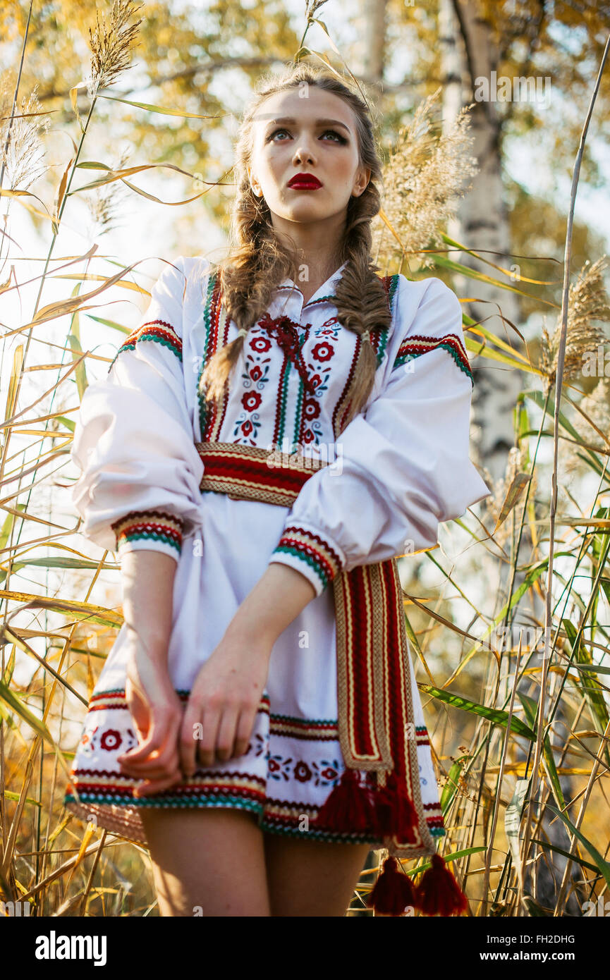 Young girl on the summer field in national Belarus clothes, fashion ...