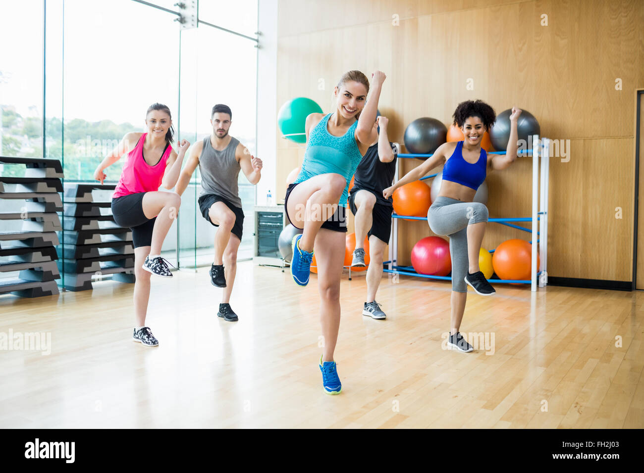 Fitness class exercising in the studio Stock Photo - Alamy