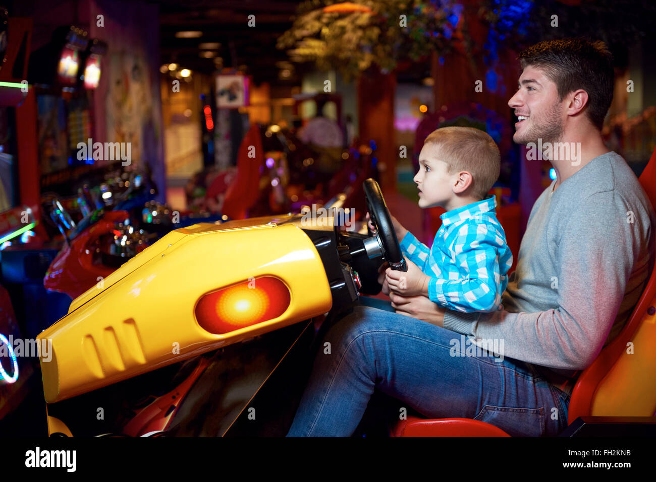 father and son playing game in playground Stock Photo - Alamy