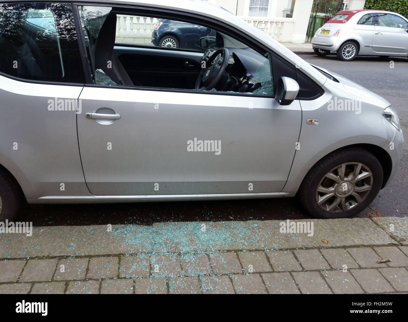 Smashed side window of parked car in South London Stock Photo Alamy
