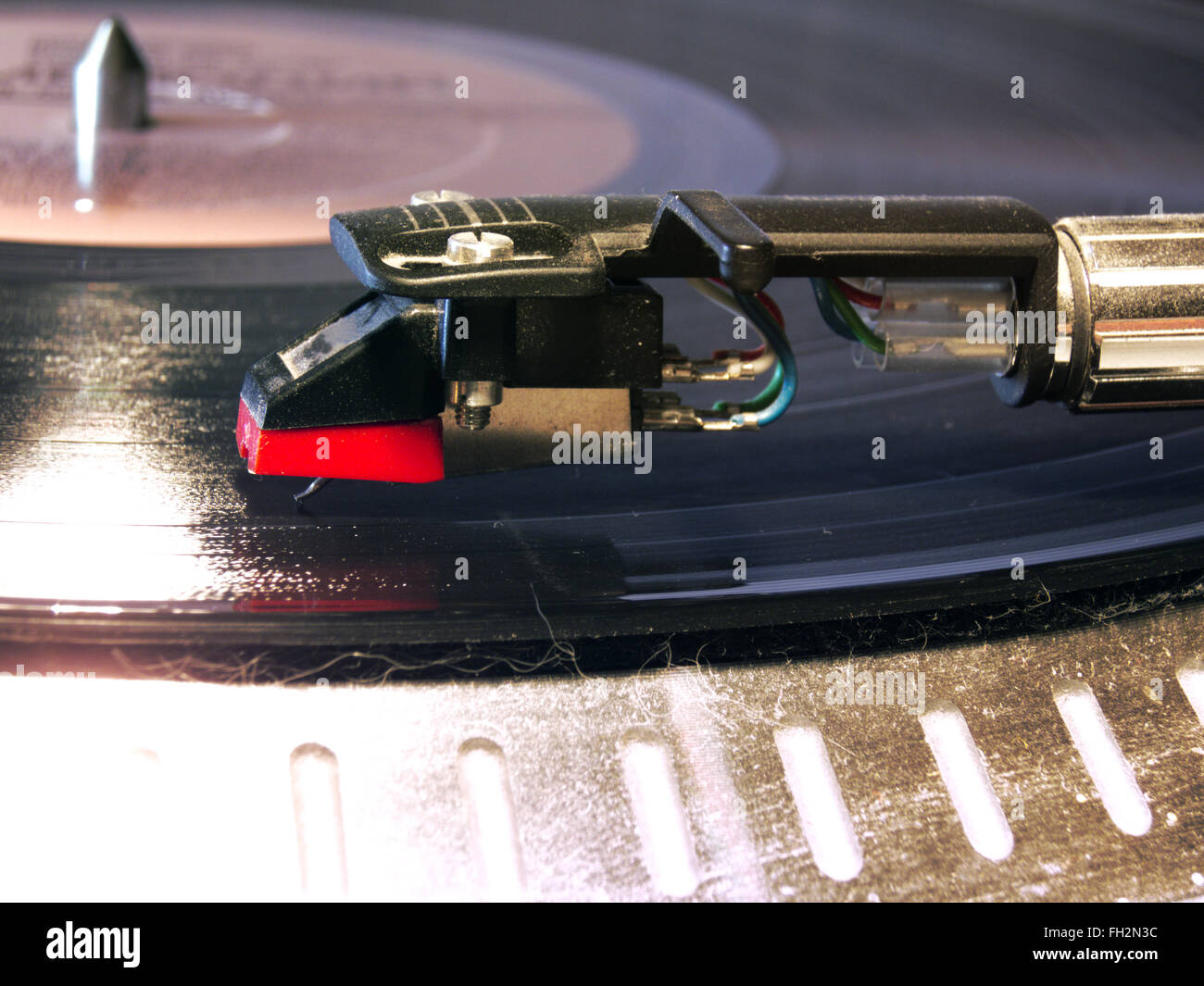 Phonograph needles Cartridge of a turntable in work, shot closeup Stock