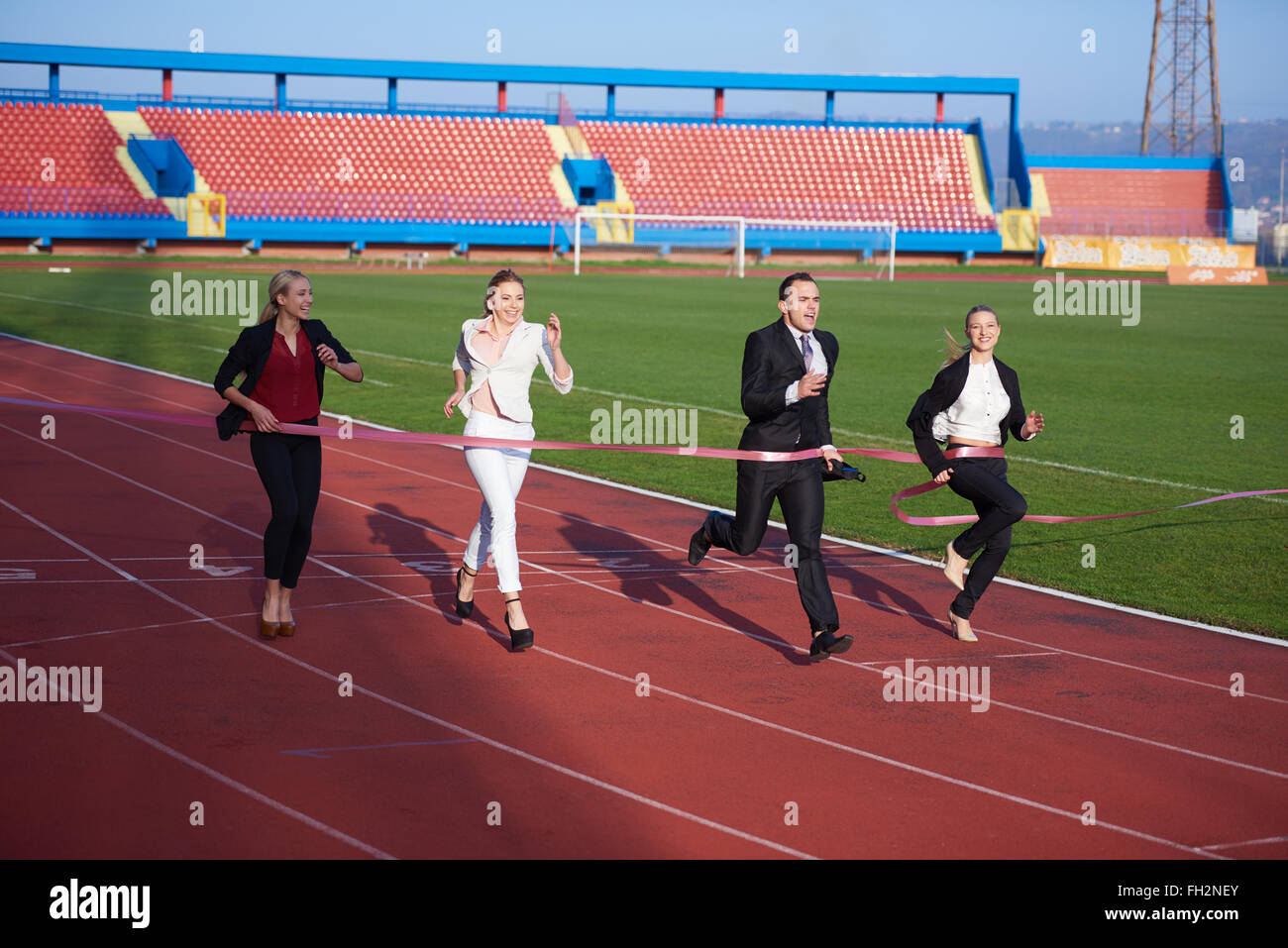 business people running on racing track Stock Photo