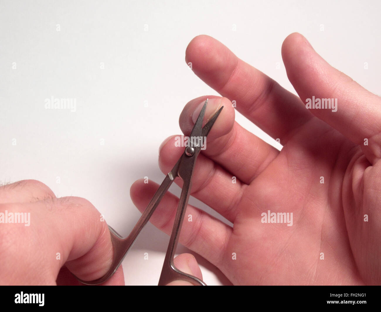 nail scissors, cutting nails, man's hand Stock Photo Alamy