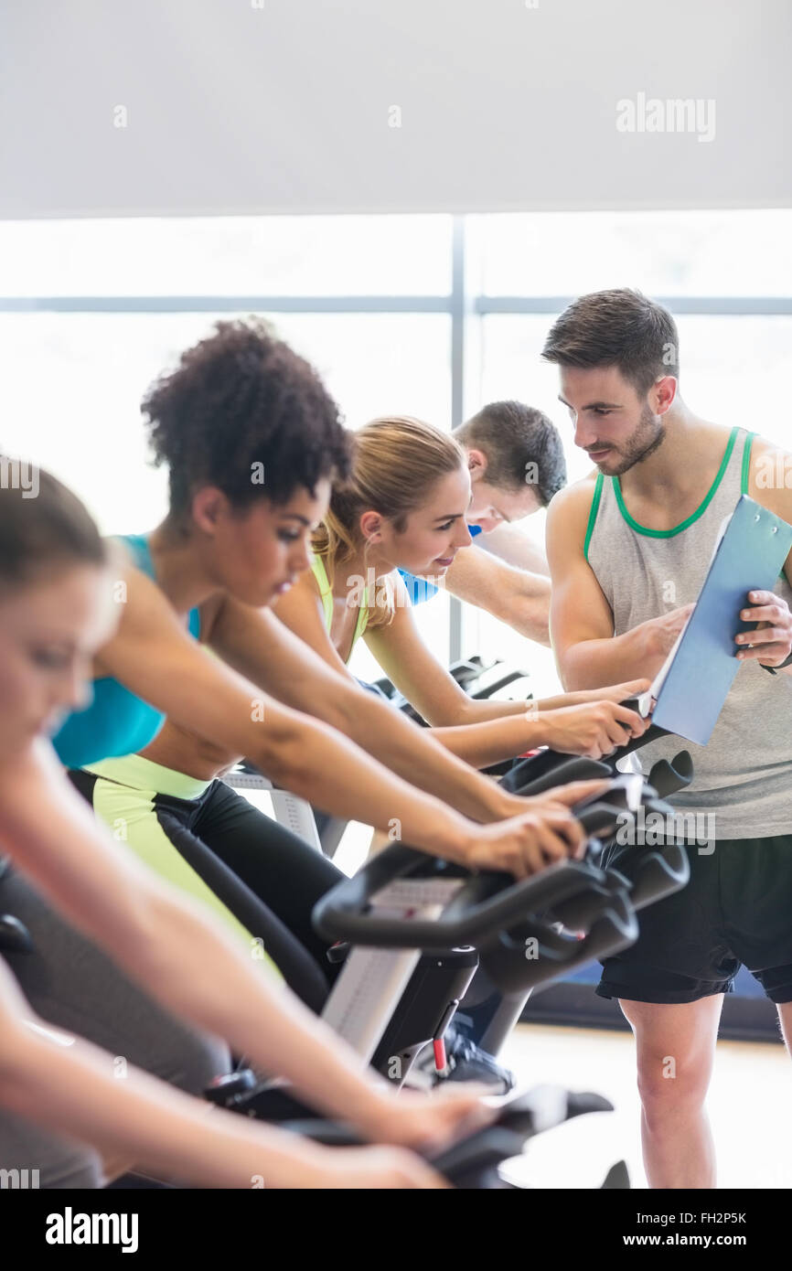 Fit people in a spin class Stock Photo - Alamy