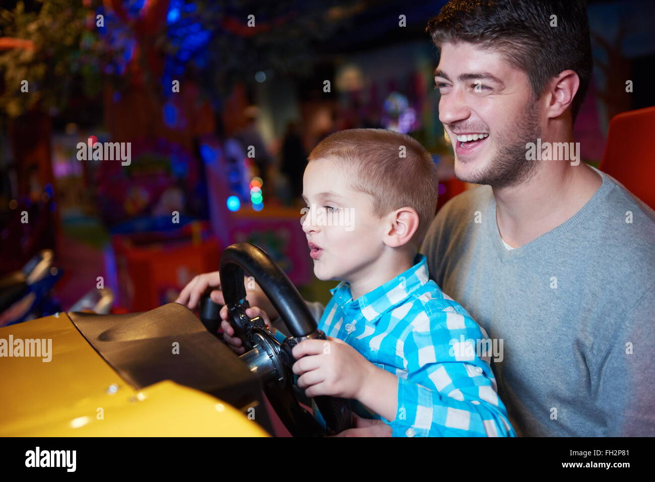 father and son playing game in playground Stock Photo - Alamy