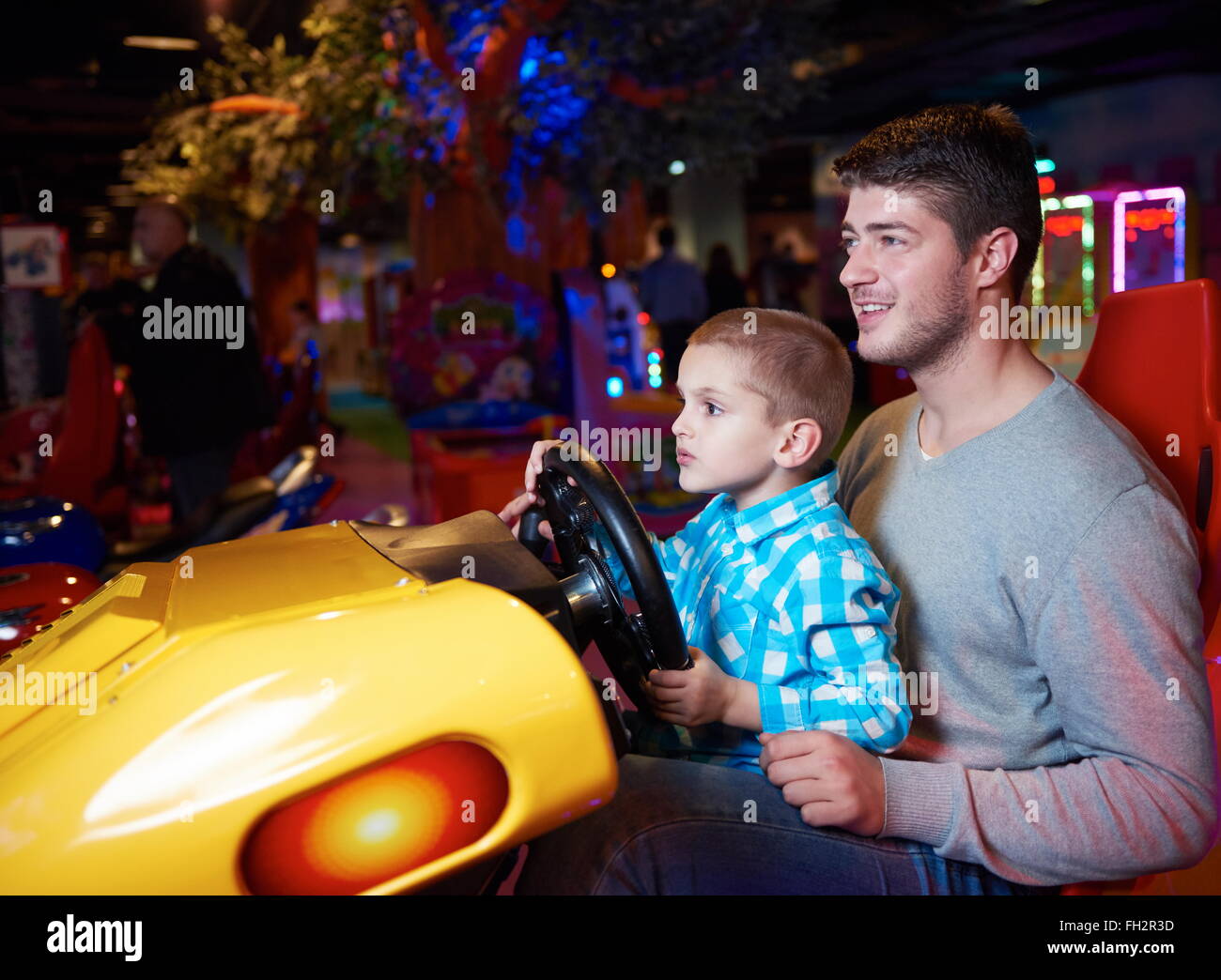 father and son playing game in playground Stock Photo - Alamy