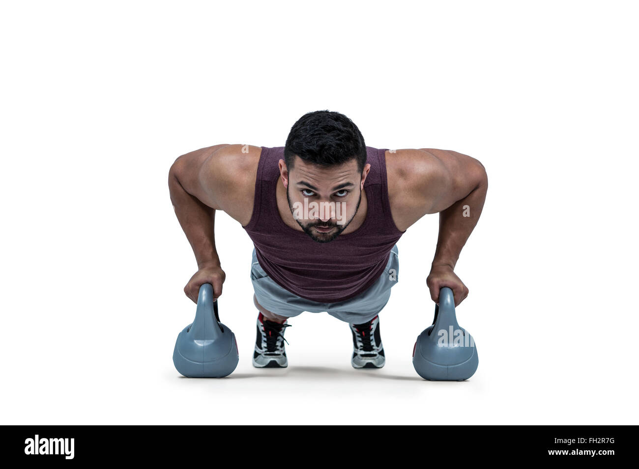 Muscular man doing push ups with kettlebells Stock Photo Alamy