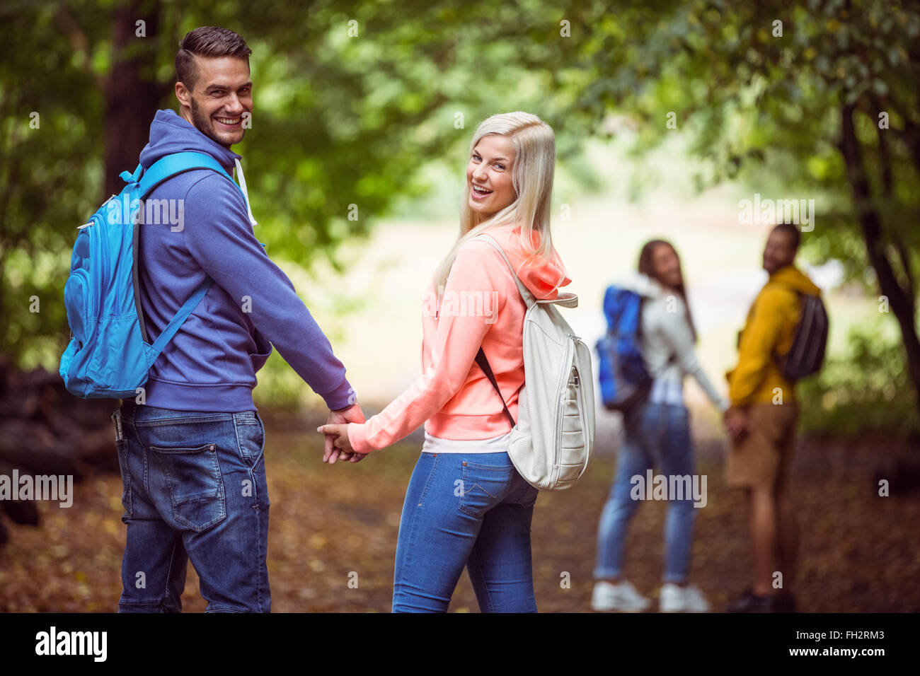 Happy friends on hike together Stock Photo - Alamy