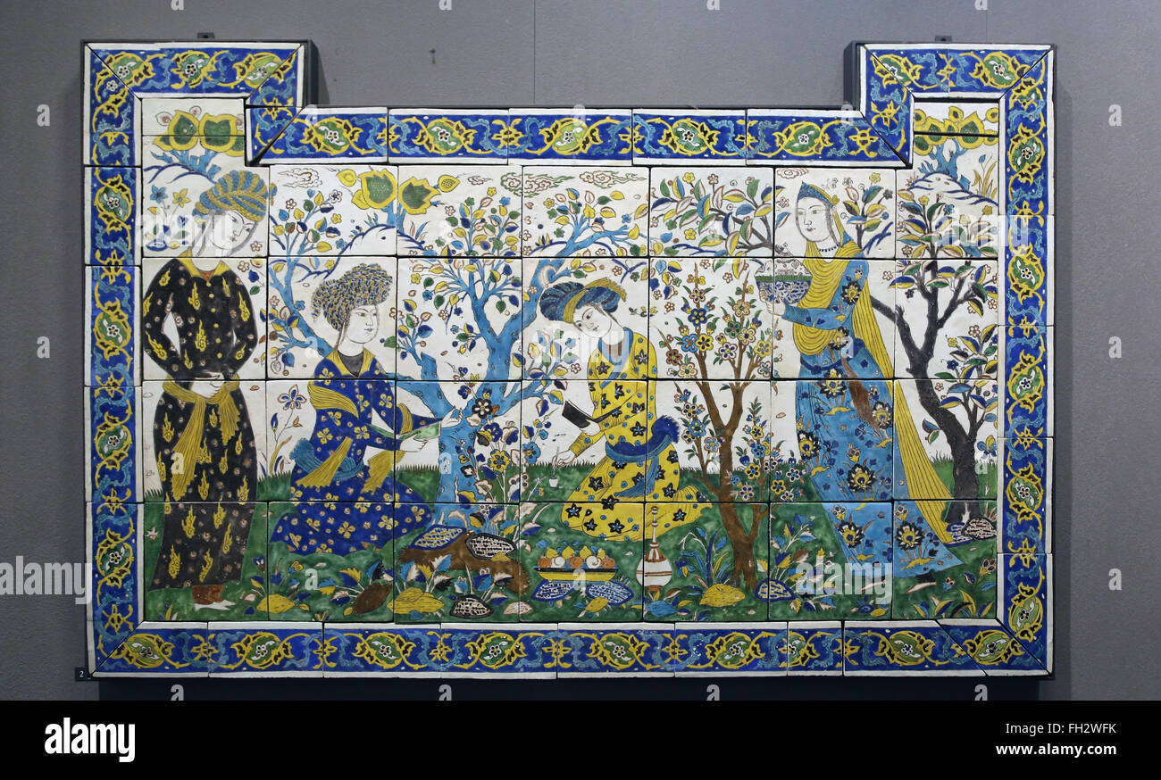 Meeting in a garden. Iran. 17th century. Colored glazed. Isfahan. Safavid period. Louvre Museum. Paris. France. Stock Photo