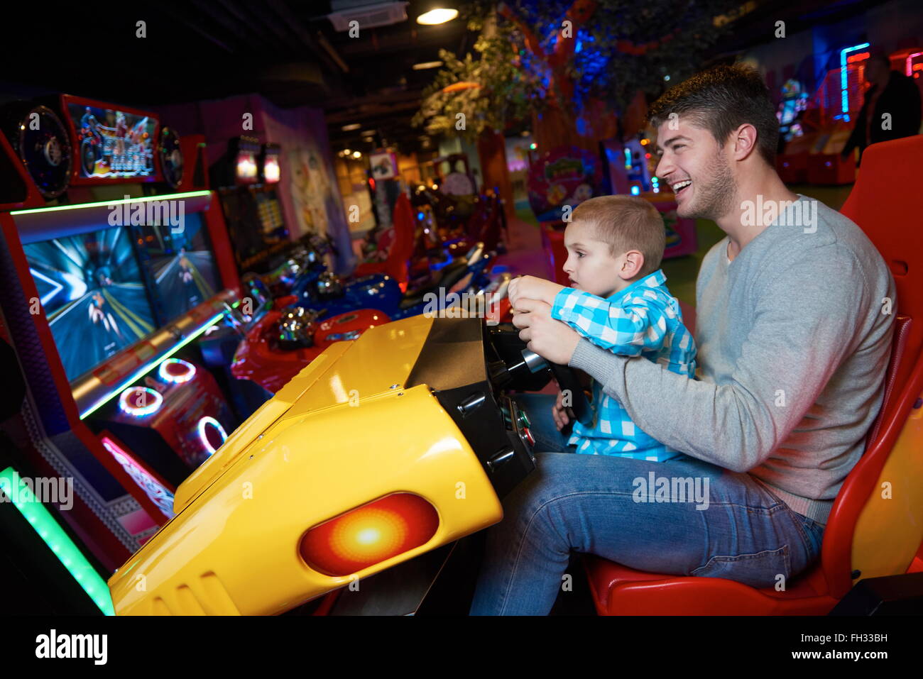 father and son playing game in playground Stock Photo - Alamy