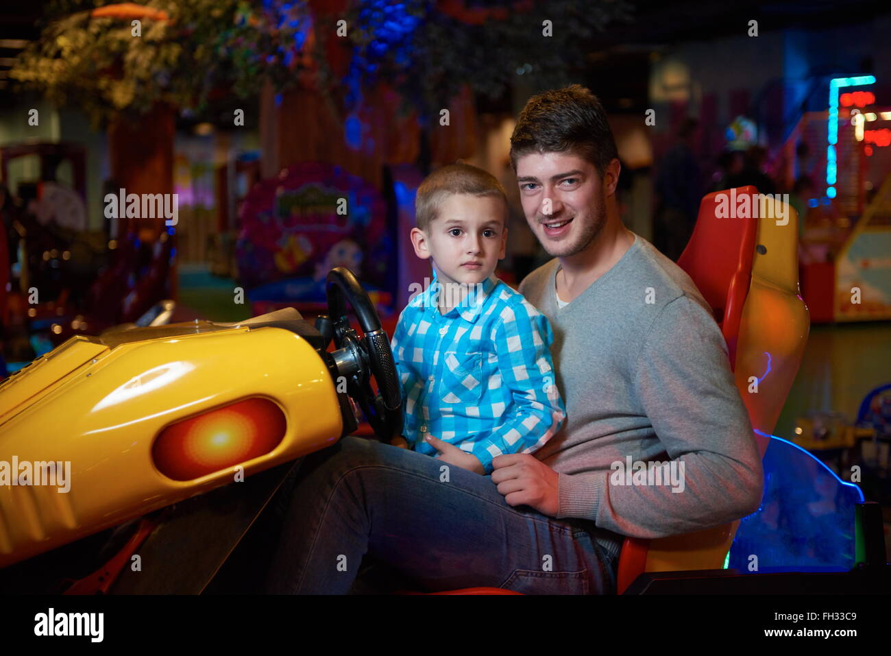 father and son playing game in playground Stock Photo - Alamy