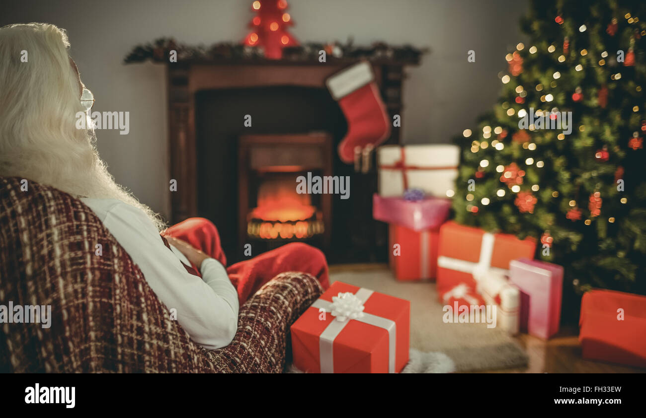Santa claus sitting on the armchair Stock Photo - Alamy