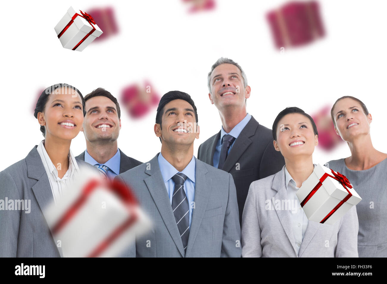 Composite image of business people looking up in office Stock Photo - Alamy