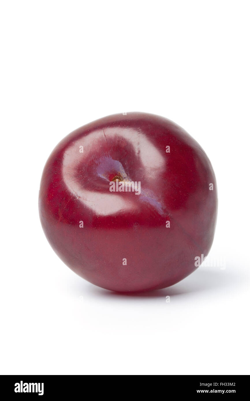 Whole single purple plum isolated on white background Stock Photo