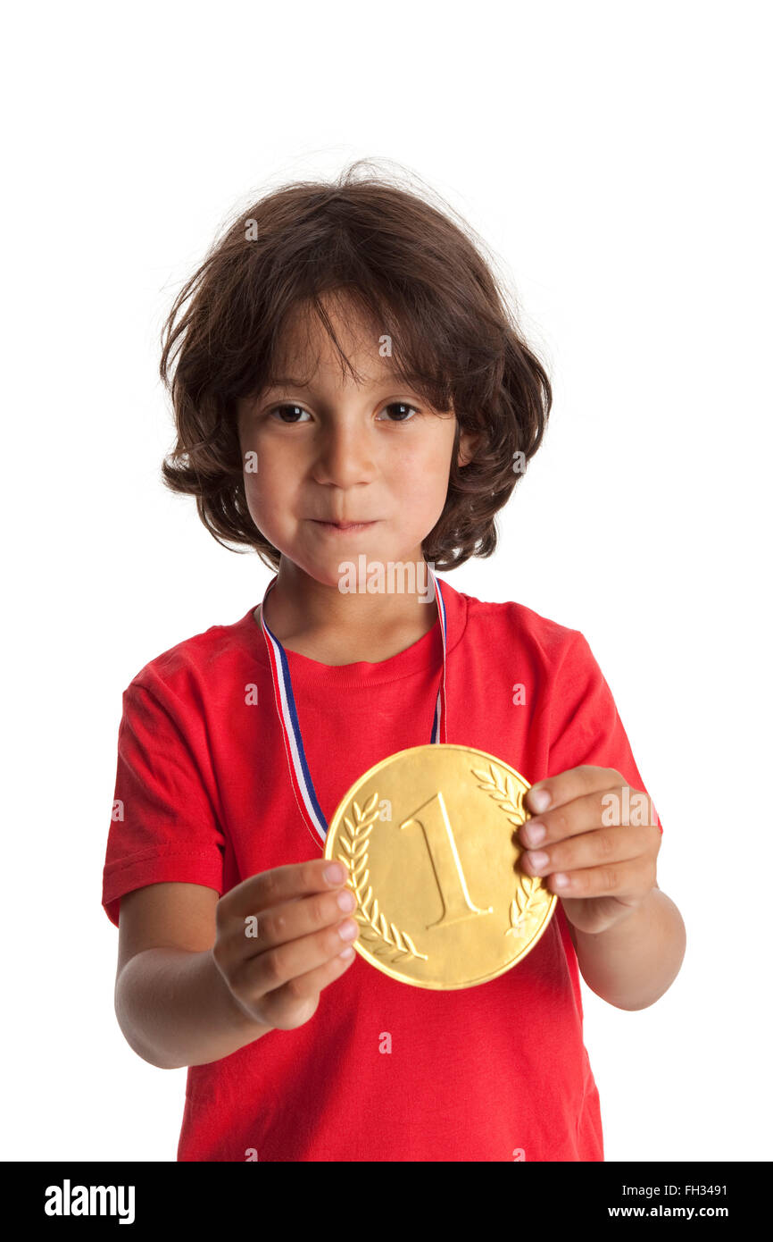 Little boy with a first place medal on white background Stock Photo