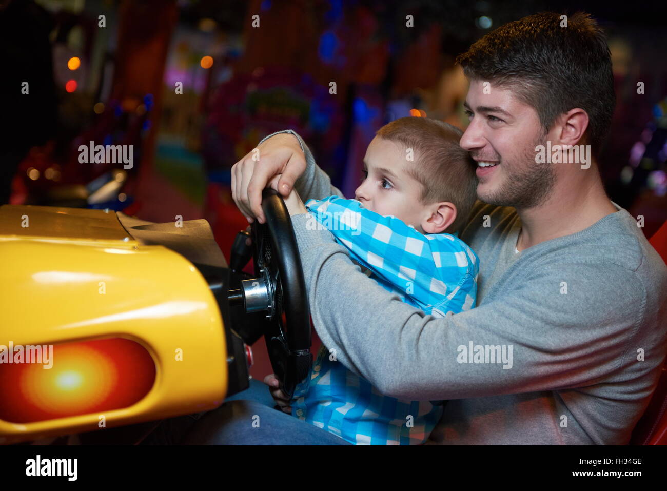 father and son playing game in playground Stock Photo - Alamy