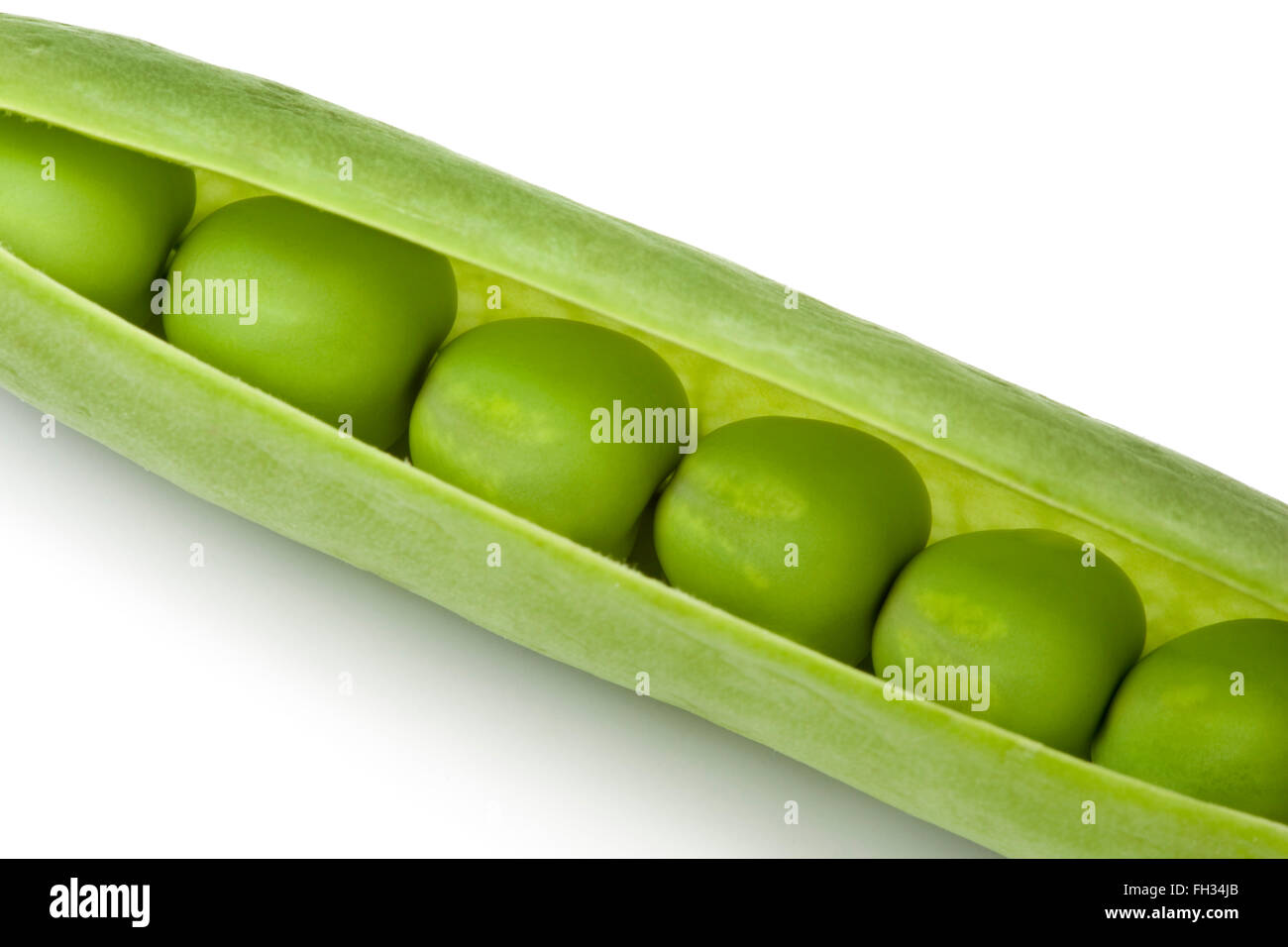 Fresh raw green peas in a pod isolated on white background Stock Photo