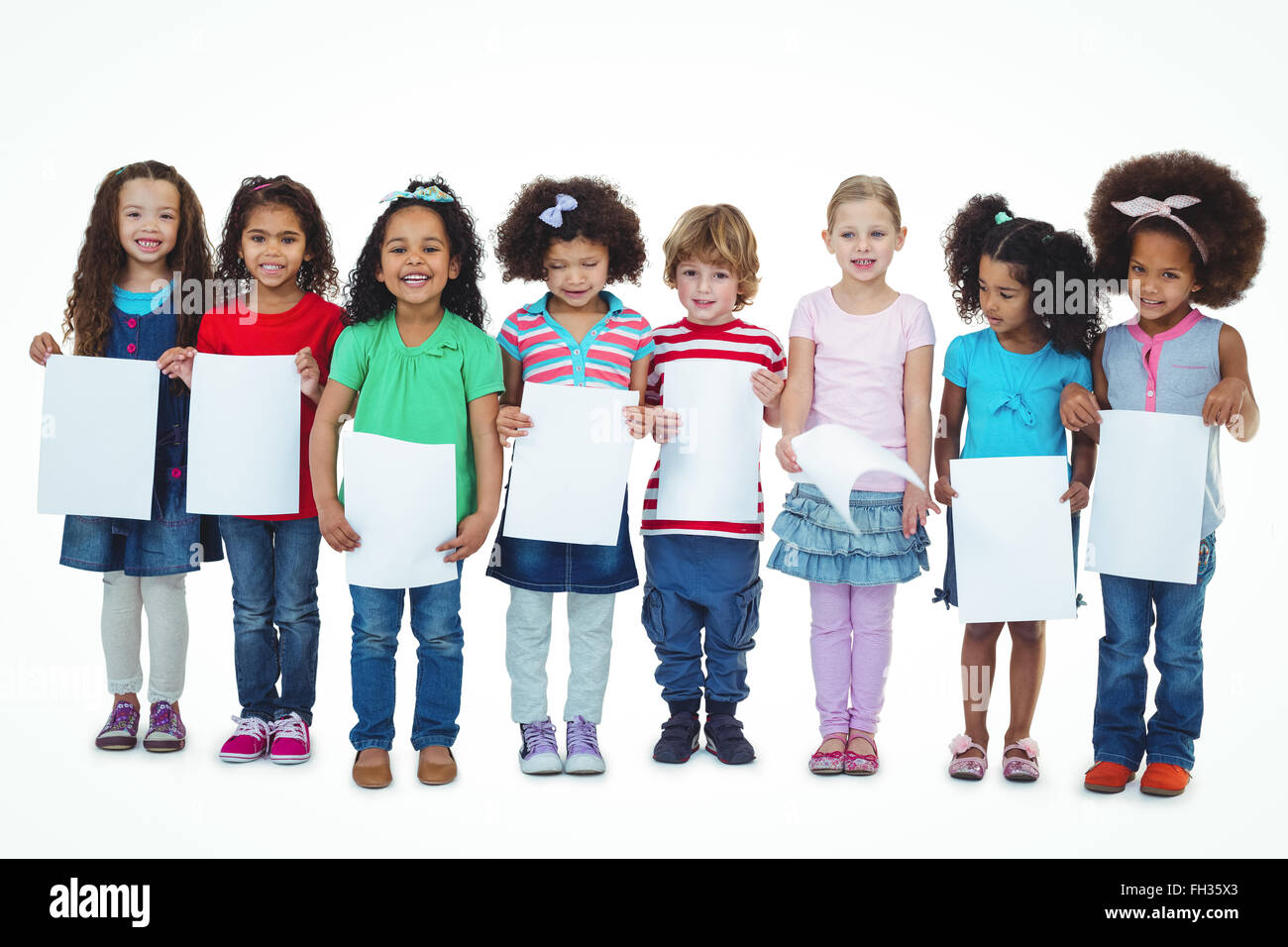 Kids standing together holding large white sheets Stock Photo - Alamy