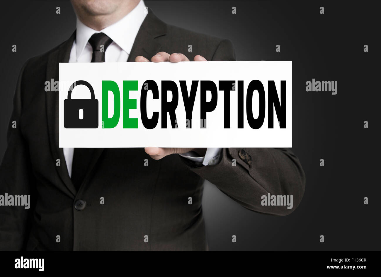 decryption sign is held by businessman. Stock Photo