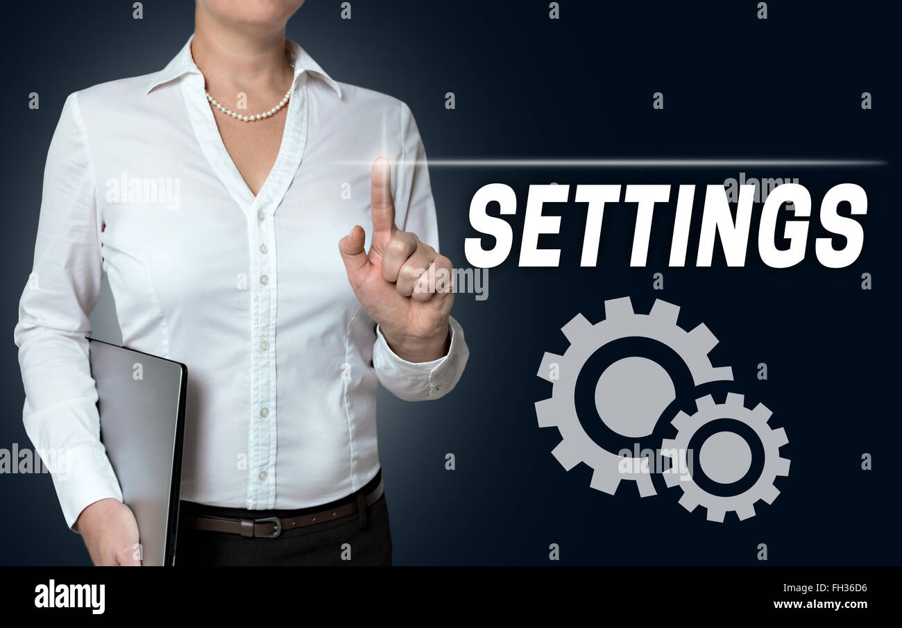 settings touchscreen is operated by businesswoman. Stock Photo