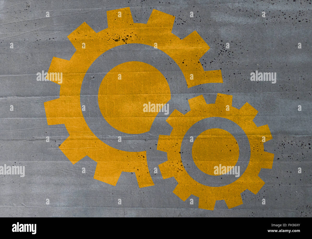 gears concept on cement texture background. Stock Photo
