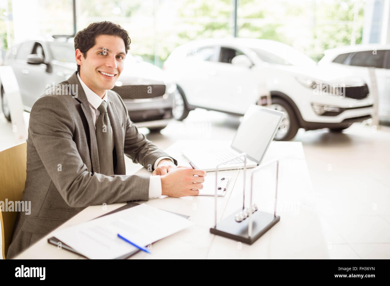 Car salesman sitting desk in hires stock photography and images Alamy