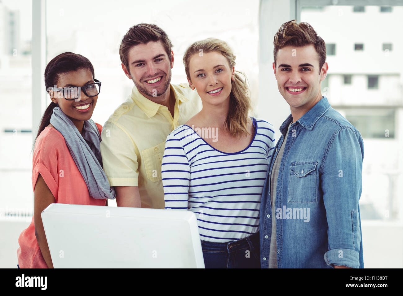 Creative business team working hard together on pc Stock Photo - Alamy