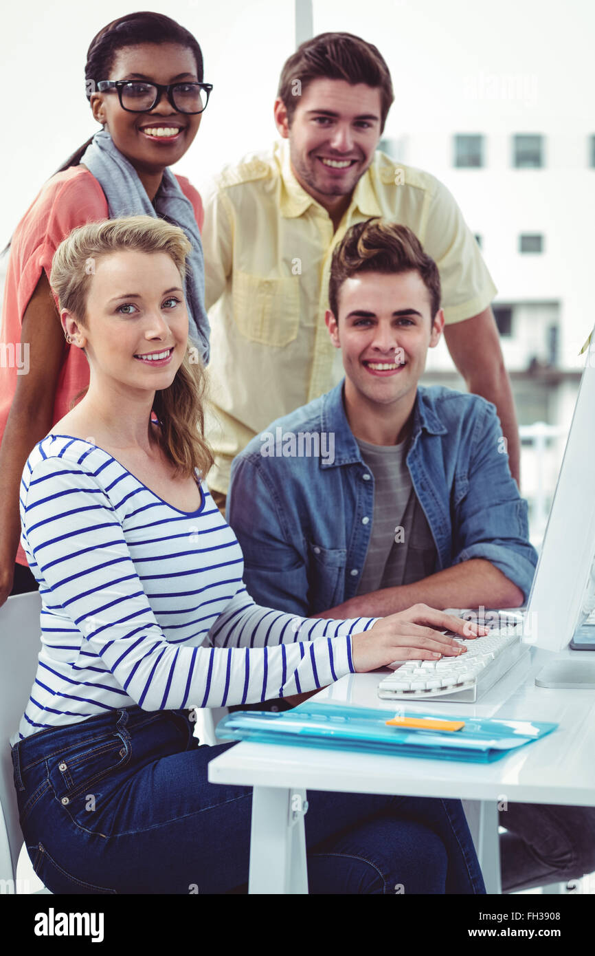 Creative business team working hard together on pc Stock Photo - Alamy