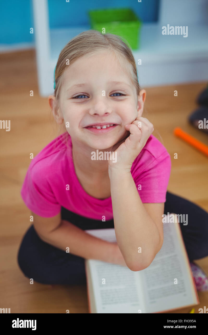 Smiling girl with a book Stock Photo - Alamy