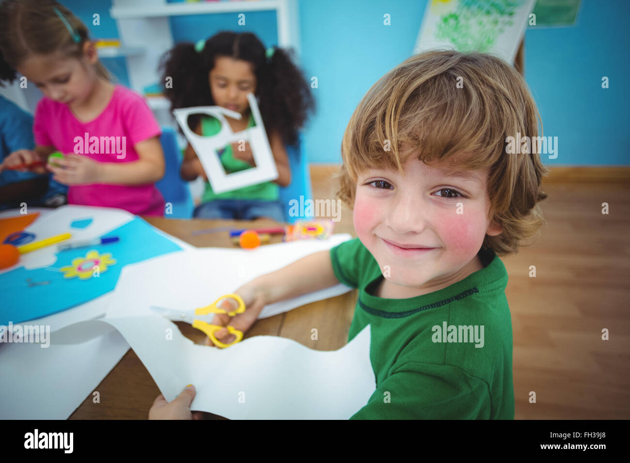 Happy kids doing arts and crafts together Stock Photo Alamy