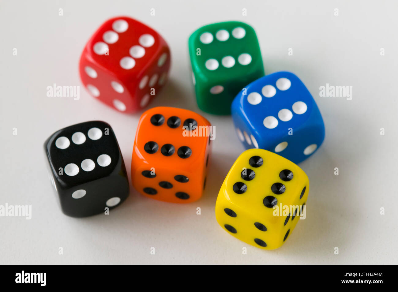 Close up of di or dice showing the faces where dots or spots are used