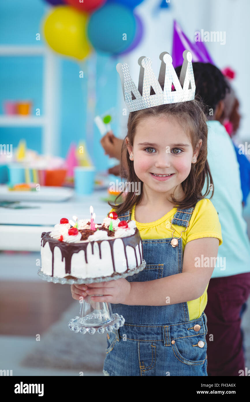 Smiling girl holding birthday cake Stock Photo Alamy