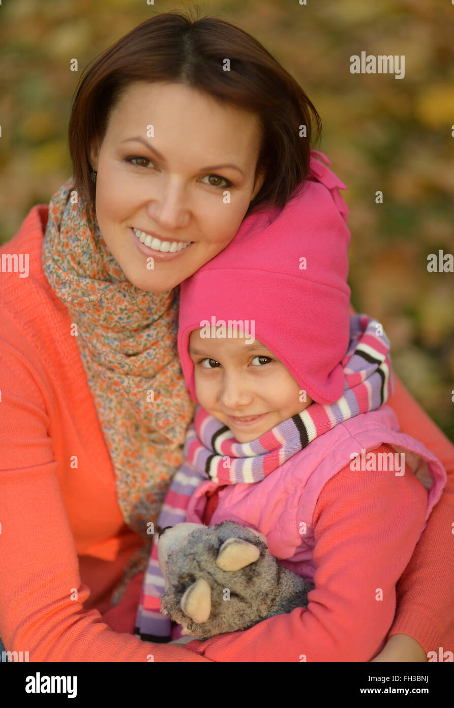 Mother with daughter in autumn park Stock Photo - Alamy