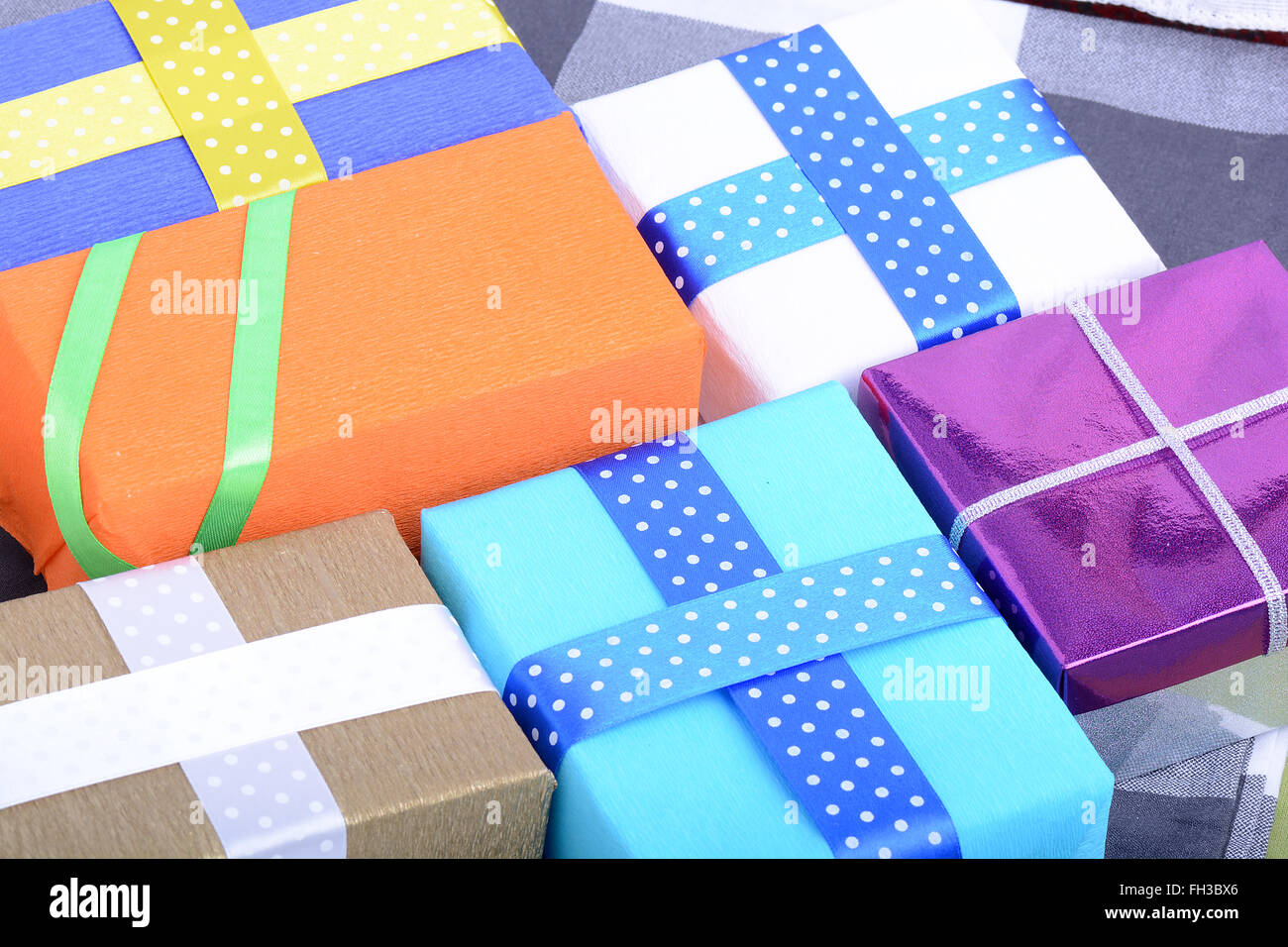 bright gifts with ribbons, holiday invitation card Stock Photo - Alamy